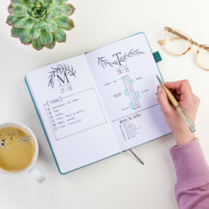 Open planner on desk with task list